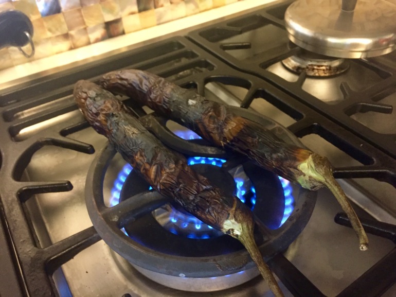 Steaming the eggplant over open flame helps to peel the skin off easily.